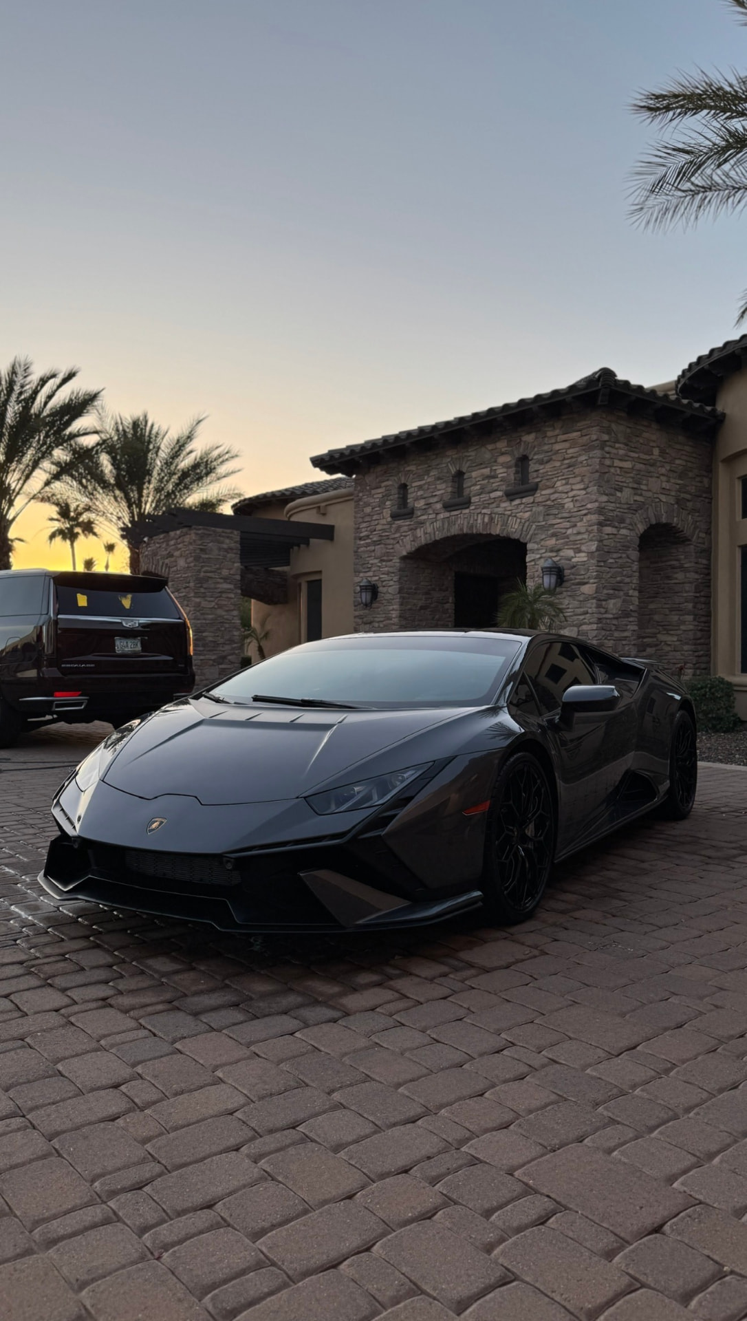 Freshly detailed black Lamborghini Huracan with a mirror-gloss finish after a Fiel Auto mobile detail