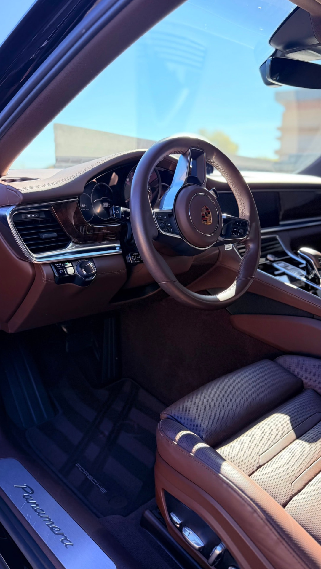 Clean Porsche Panamera interior with cognac leather seats after detailing