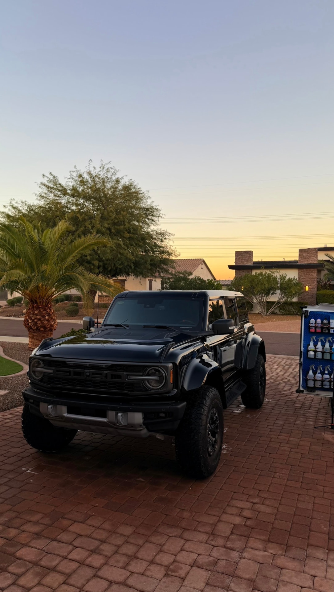 Black Ford Bronco Raptor detailed at sunset in a Valley driveway